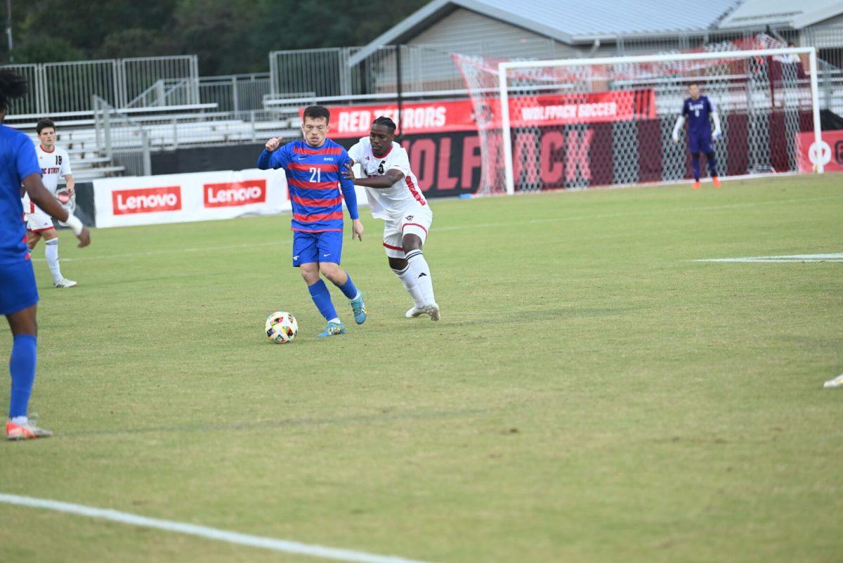 Senior midfielders Vasumzi Plamana defends against the SMU offense at Dail Soccer Field on Saturday, Oct. 19, 2024. NC State beat SMU 5-1.