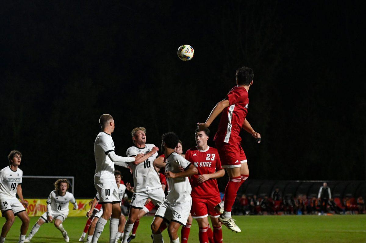 Wolfpack and Cardinal players battle for the incoming corner kick during the game at Dail Soccer Field,&#160;on Sunday, Oct. 27. NC State defeated Louisville 1-0.