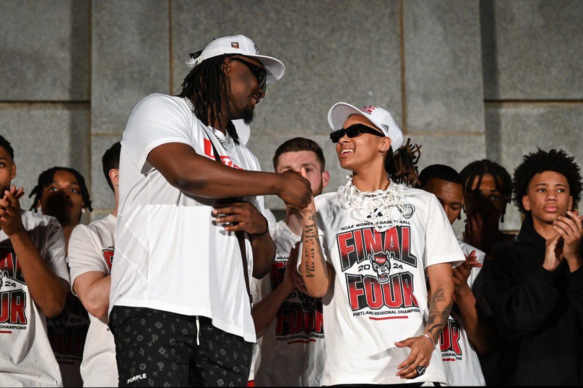 Graduate forward DJ Burns and junior guard Aziaha James shake hands during the men's and women's basketball Final Four celebration at the Belltower on Monday, April 15, 2024. Burns and James were their respective regionals Most Outstanding Player.