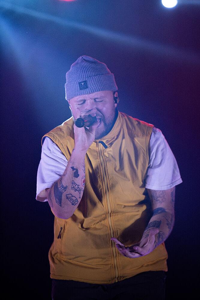 Quinn XCII sings during his concert at Red Hat Amphitheater on Friday, Oct. 25, 2024. Quinn XCII performed in Raleigh as the second to last stop of his "All You Can Eat" tour.