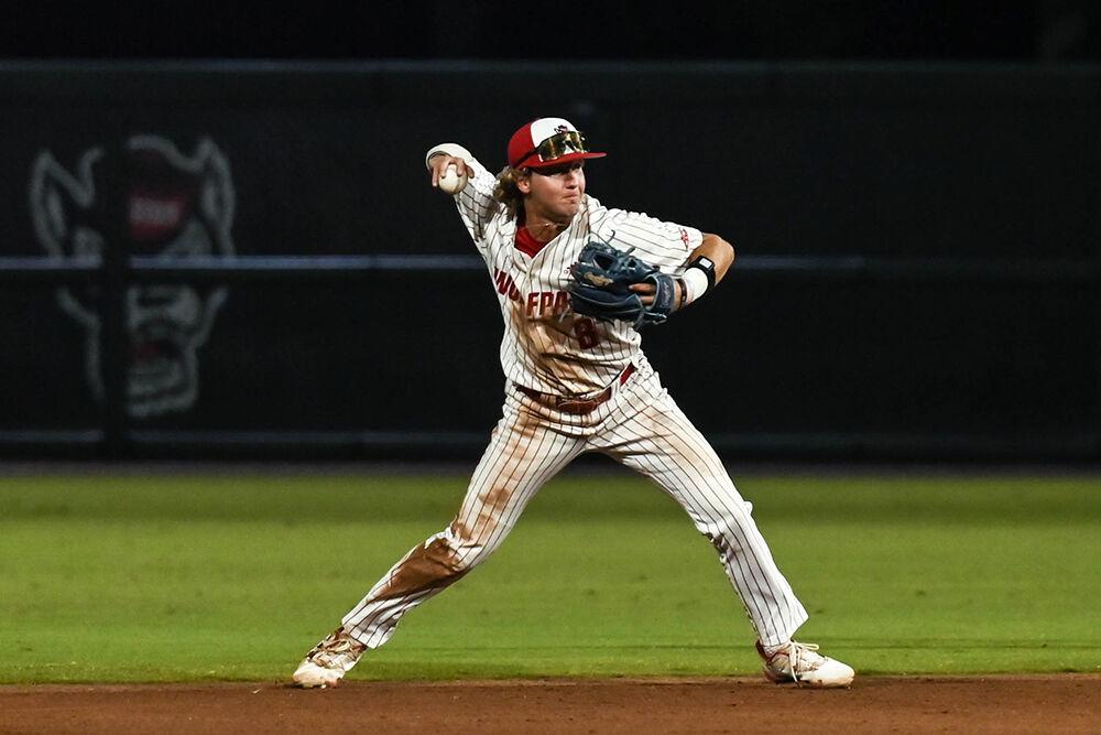 Senior infielder Justin DeCrisco gets ready to throw the ball during the game against Elon at Doak Field at Dail Park on Wednesday, Oct. 9, 2024. NC State beat Elon 20-4 to win the fall game at their home stadium.
