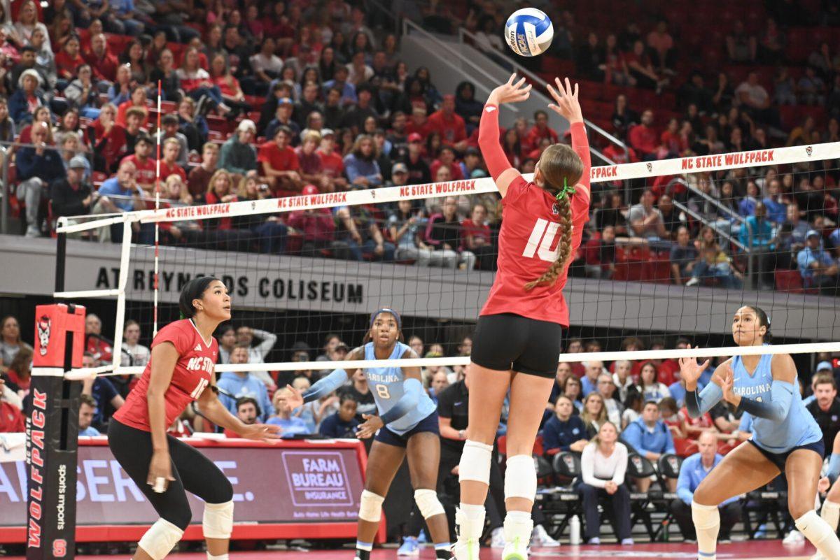 Freshman setter Kate Peterson sets the ball during the volleyball match against UNC-Chapel Hill on Friday, Oct. 11, 2024. The Wolfpack defeated the Tar Heels 3-1.