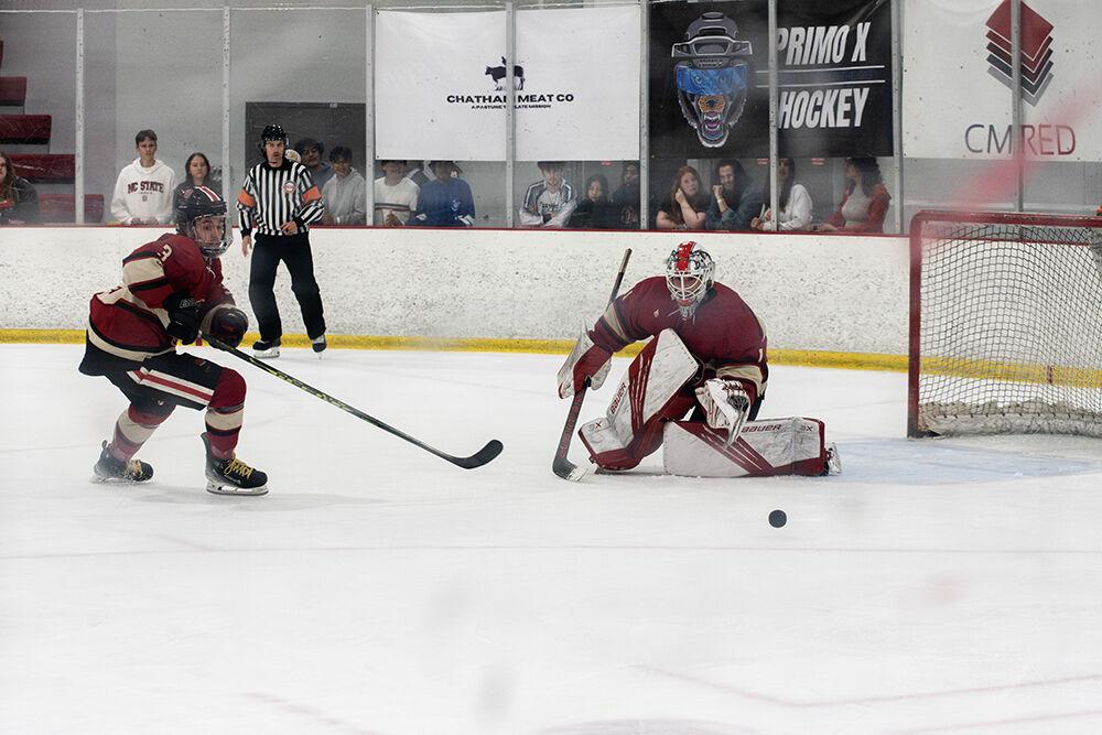 Senior goaltender Isaac Tawyer protects the goal while freshman defender Jackson Weglarz dashes for the puck during match against Alabama at the Invisalign Arena on Saturday, Oct. 5, 2024. The Wolfpack defeated the Crimson Tide 5-2.