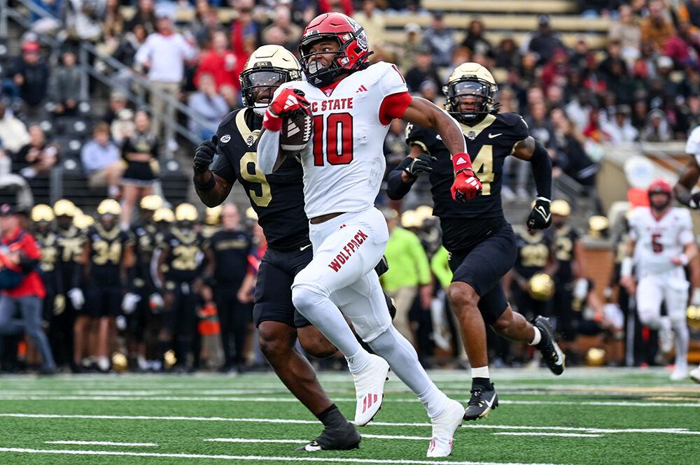 Freshman wide receiver Kevin Concepcion rushes the ball down the field during the game against Wake Forest at Allegacy Federal Credit Union Stadium on Saturday, Nov. 11, 2023. Concepcion recorded 105 yards of total offense. NC State beat Wake Forest 26-6.