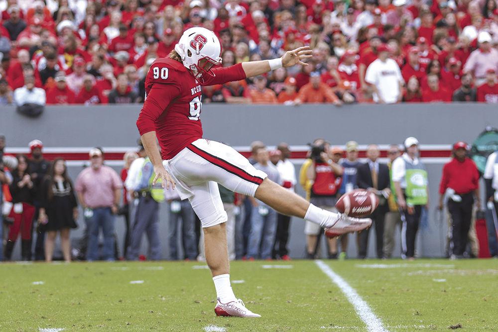 A.J. Cole III punts from the NC State side of the field and blasts the ball over 50 yards, giving the Tigers less-than-favorable field position. Cole finished the game with 5 punts for 253 total yards and an average of 50.6 yards per punt. Three of the five punts were over 50 yards. The Wolfpack fell to the Tigers 56-41 in Carter-Finley Stadium, on October 31st, 2015.
