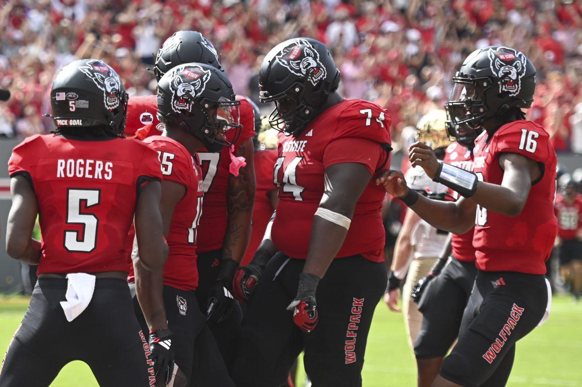 Tight end junior Justin Joly celebrates with the rest of the team after making a touchdown during the football game against Wake Forest in Carter-Finley Stadium on Saturday, Oct. 5, 2024. Joly scored one touchdown. NC State lost to Wake Forest 34-30.