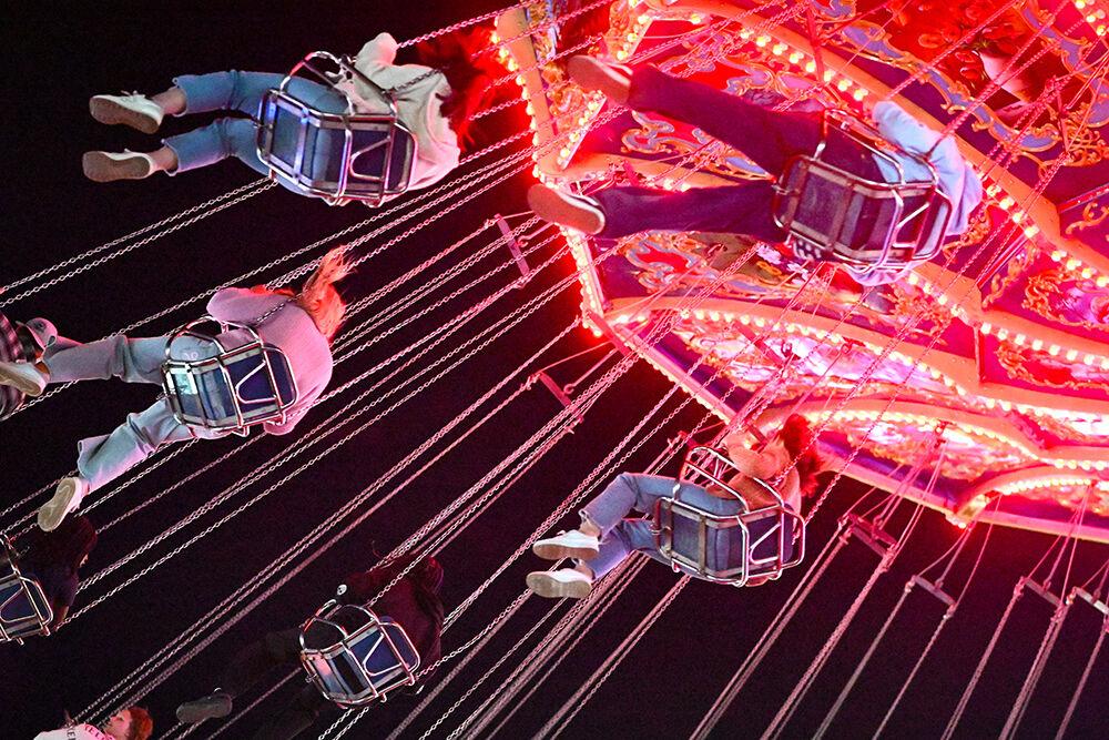 Fairgoers soar through the air on a swing ride at the North Carolina State Fair in Raleigh on Thursday, Oct. 24, 2024.&#160;The fair was held from Oct. 17-27, 2024.