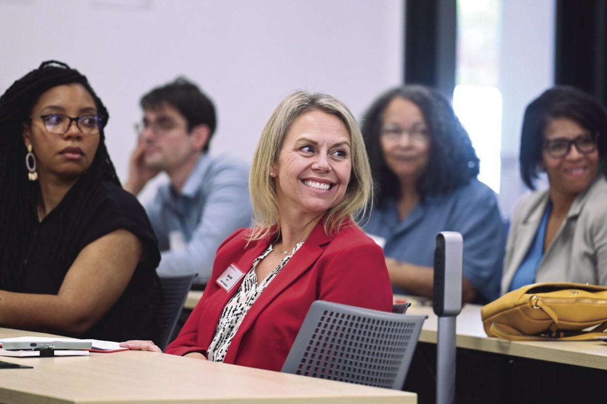 Sarah Hall, Director of the Institute for Emerging Issues, laughs during an Energy Week conversation at Partners I on Thursday, Oct. 3, 2024. The conversation was titled Leading the Clean Energy Transition and featured a discussion with Dr. Henry McKoy, Senior Advisor to the Undersecretary for the U.S. Office of Science and Innovation, focused on the future of sustainable energy and community impact.