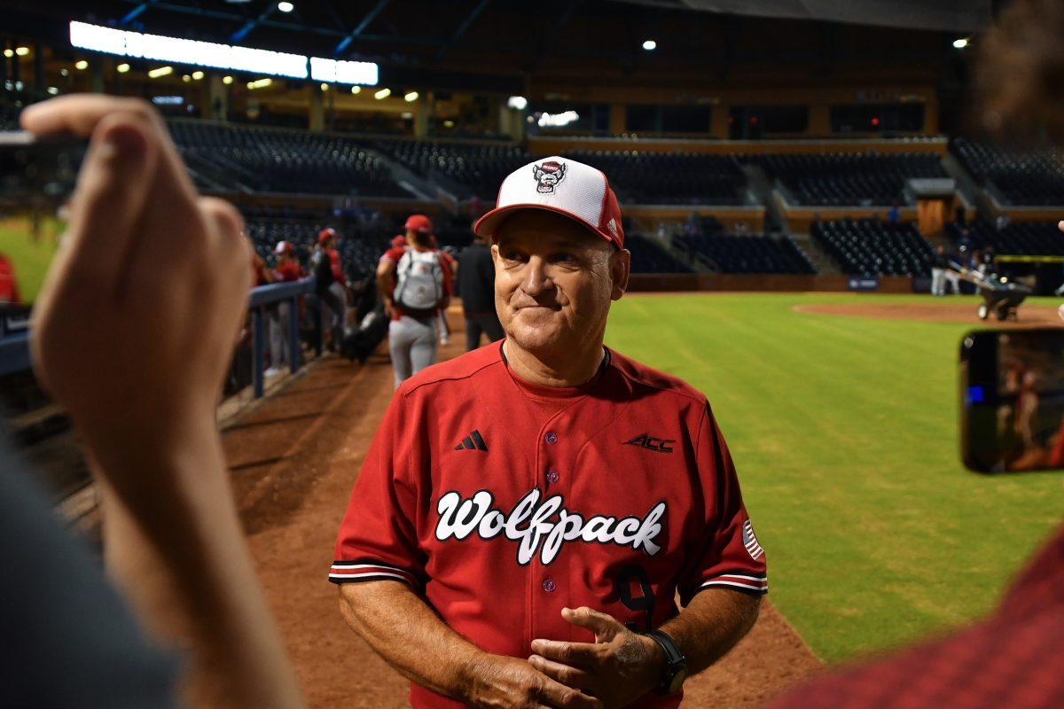 Head coach Elliott Avent talks with members of the media after the second game of NC State's fall baseball games against the Duke Blue Devils in Durham Athletic Park on Friday, Oct. 4, 2024. The Blue Devils beat the Wolfpack 5-2 in both contests.