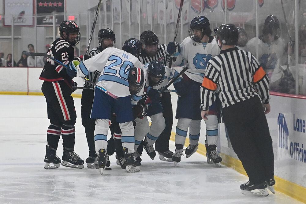 NC State players and UNC-Chapel Hill players are separated by referees during the game against UNC-Chapel Hill at Invisalign Arena on Friday, Oct. 11, 2024. UNC-Chapel Hill defeated NC State 6-5.