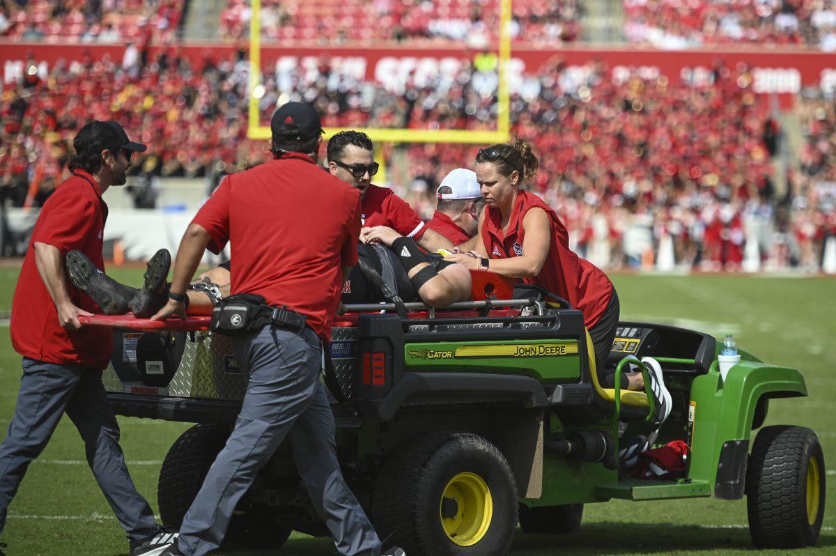 Graduate quarterback Grayson McCall gets carted off the field during the football game against Wake Forest in Carter-Finley Stadium on Saturday, Oct. 5, 2024. The game against Wake Forest was McCall's first game since his was injured during the game against Louisiana Tech. NC State lost to Wake Forest 34-30.