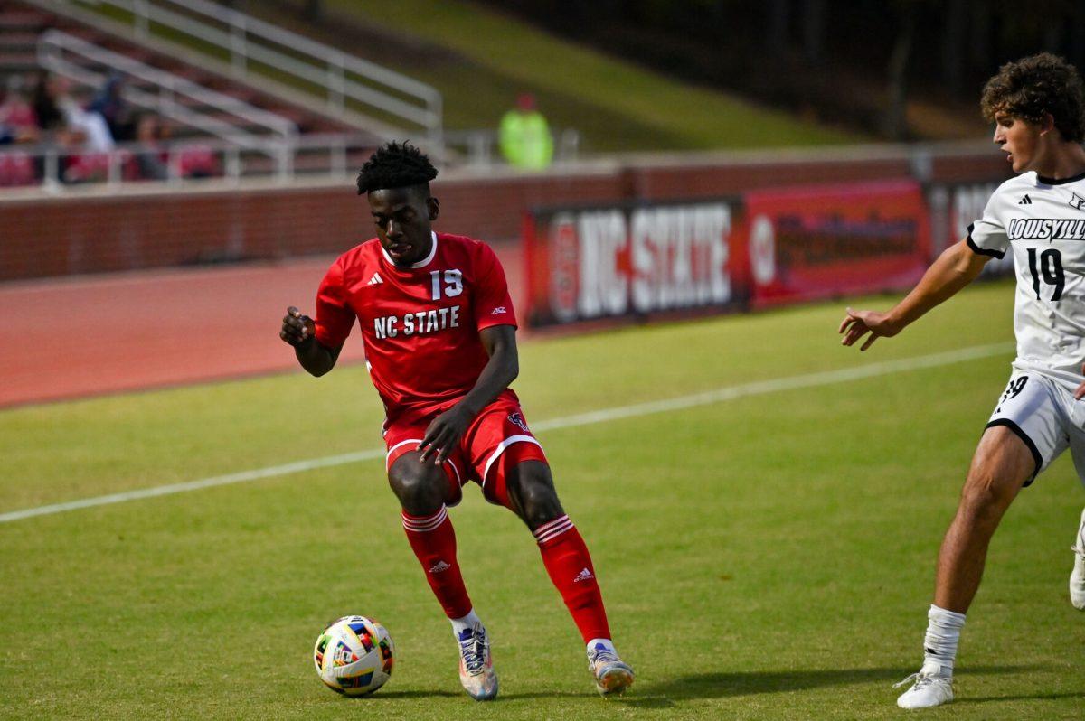 Senior defender Yves Tcheuyap drives down the field during the game against Louisville at Dail Soccer Field on Sunday, Oct. 27, 2024. NC State defeated University of Louisville 1-0.