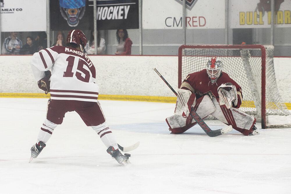 Senior goaltender Isaac Tawyer faces off with his opponent during match against Alabama at Invisalign Arena on Saturday, Oct. 5, 2024. NC State beat Alabama 5-2.