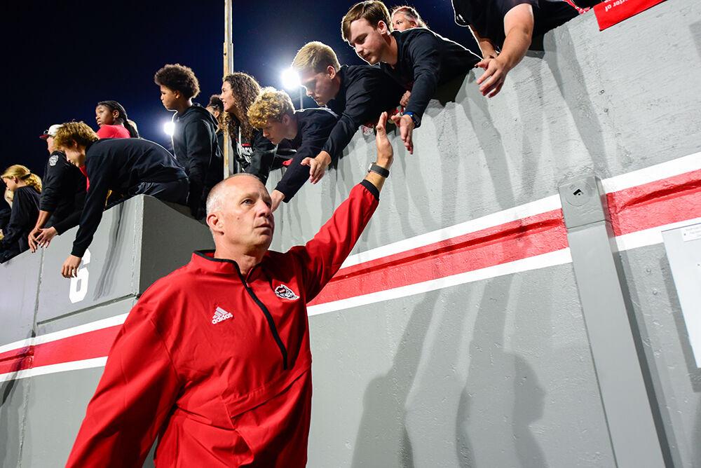 Head coach Dave Doeren blankly walks off the field after the game against Syracuse in Carter-Finley Stadium on Saturday, Oct. 12, 2024. NC State suffered its fourth loss of the season. The Orange defeated the Wolfpack 24-17.
