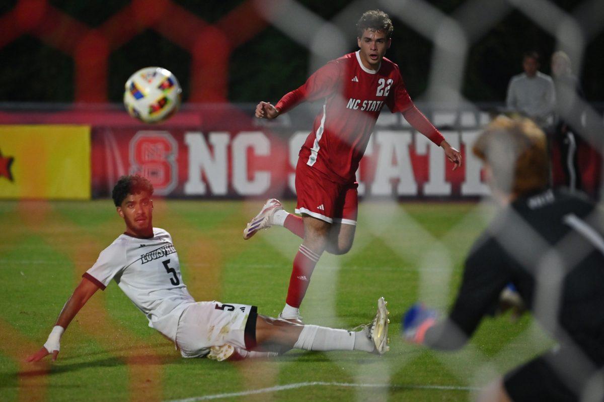 Junior forward Drew Lovelace shoots during the Wolfpack's final home soccer game of the regular season against the Louisville Cardinals at Dail Soccer Field on Sunday, Oct. 27, 2024. The Wolfpack beat the Cardinals 1-0.
