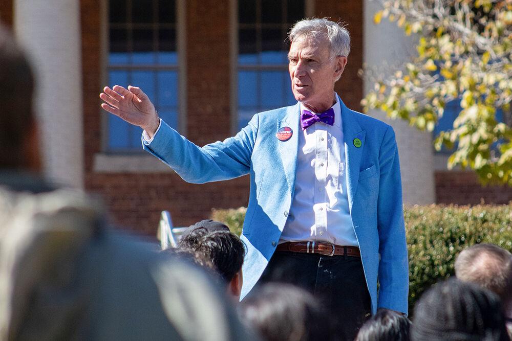 Bill Nye, science communicator, motions to a crowd at the Court of North Carolina on Saturday, Oct. 19, 2024. This event was in association with the North Carolina Democratic party's campaign across eastern North Carolina.