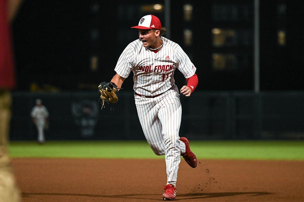 Sophomore infielder Matt Ossenfort catches the ball and runs towards first base during the game against Elon at Doak Field at Dail Park on Wednesday, Oct. 9, 2024. NC State beat Elon 20-4 to win the fall game at their home stadium.