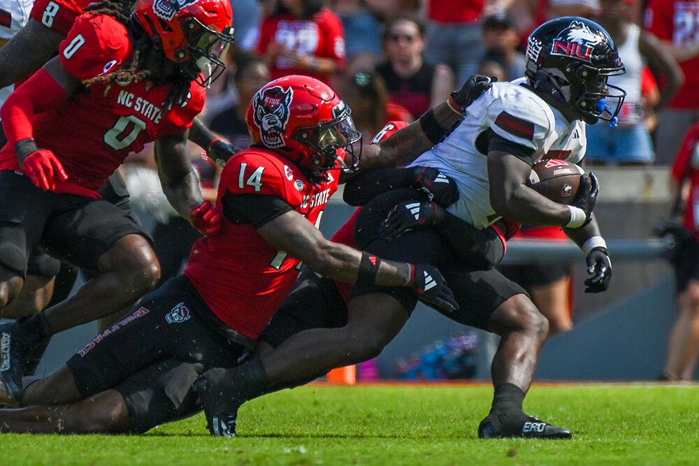 Redshirt junior safety Rente Hinton tries to pull down the ball carrier during the football game against Northern Illinois at Carter-Finley Stadium on Saturday, Sept. 28, 2024. The Wolfpack beat the Huskies 24-17.