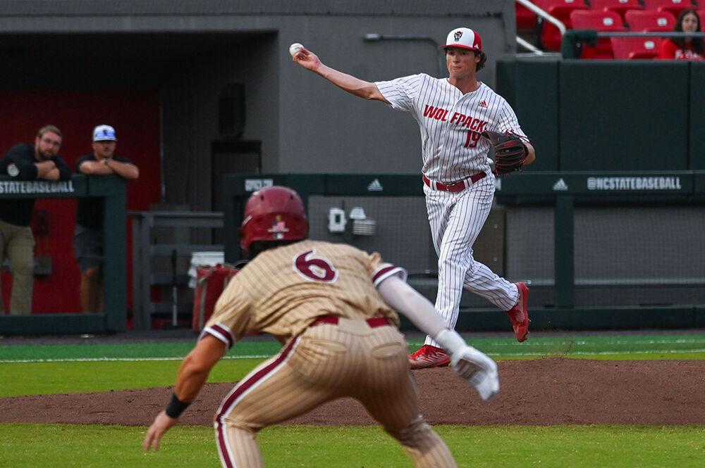 Sophomore pitcher Heath Andrews picks off Elon's sophomore pitcher and infielder Justin Szestowicki in the game against Elon at Doak Field at Dail Park on Wednesday, Oct. 9, 2024. NC State defeated Elon 20-4.