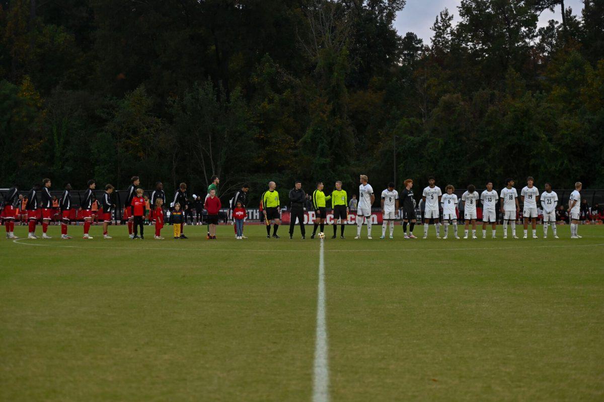 Both teams line up for player introductions and the national anthem before the game at Dail Soccer Field on Sunday, Oct. 27, 2024. NC State defeated Louisville 1-0.