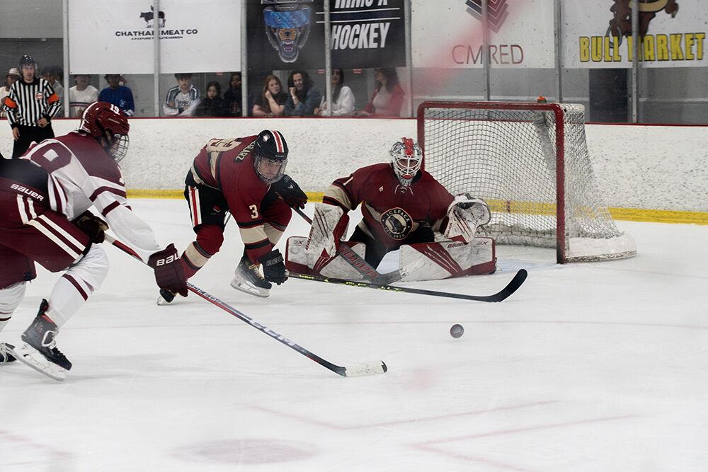 Senior goaltender Isaac Tawyer protects the goal while freshman defender Jackson Weglarz dives for the puck during match against Alabama at the Invisalign Arena on Saturday, Oct. 5, 2024. The Wolfpack defeated the Crimson Tide 5-2.