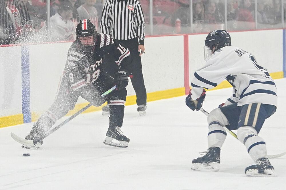 Freshman forward Reece Johnson kicks up powder during the game against the University of New Hampshire at Invisalign Arena on Friday, Oct. 18, 2024. The Wolfpack lost to the Wildcats 4-3.