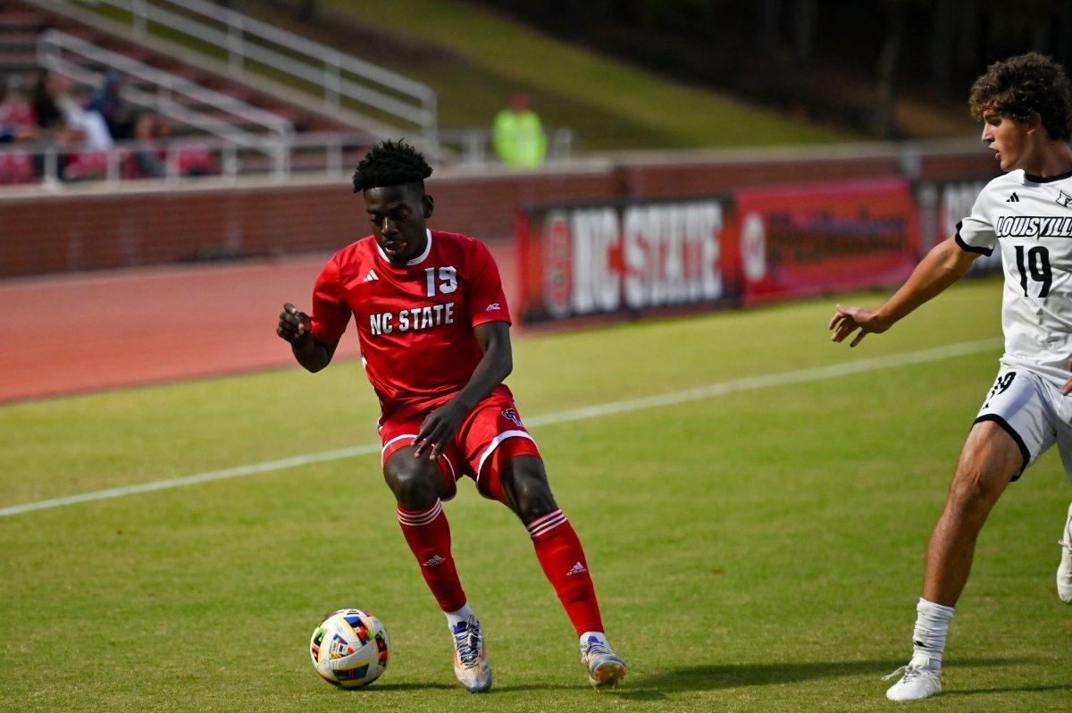 Senior defender Yves Tcheuyap drives down the field during the game against Louisville at Dail Soccer Field on Sunday, Oct. 27, 2024. NC State defeated University of Louisville 1-0.
