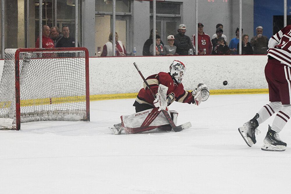Senior goaltender Isaac Tawyer tries to catch the puck during match against Alabama in the Invisalign Arena on Saturday, Oct. 5, 2024. The Wolfpack defeated the Crimson Tide 5-2.