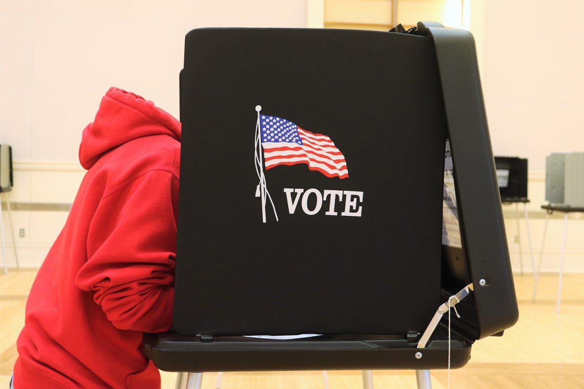 Courtney Wright, a fourth-year at NCSU majoring in science technology and society, fills out her ballot in a voting booth in the State Ballroom in Talley Student Union on Saturday, Oct. 31, 2020. Talley Student Union hosted early voting from October 15th to October 31st in the State Ballroom.