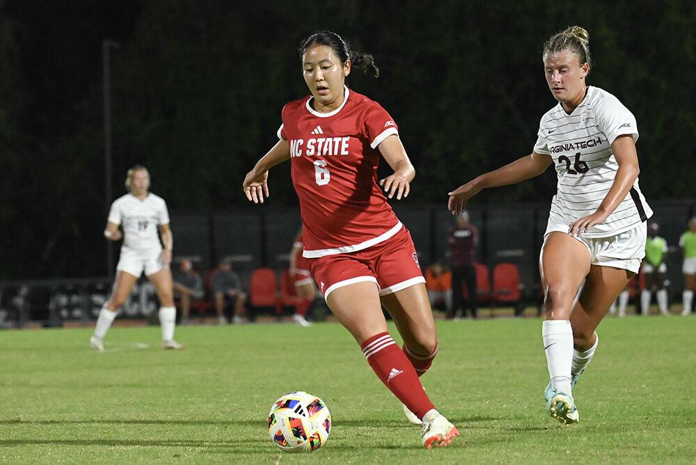 Freshman midfielder Mana Nakata cuts right with the ball during the match against Virginia Tech at Dail Soccer Field on Thursday, Oct. 24, 2024. Nakata played 82 minutes of the match. The Wolfpack tied the Hokies 0-0.