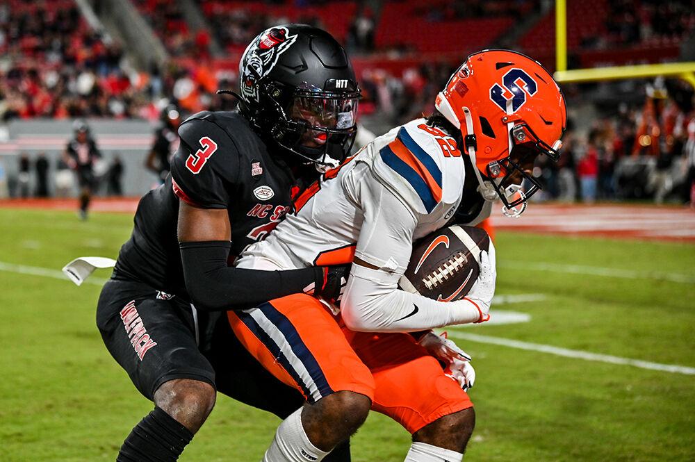Senior cornerback Aydan White attempts to tackle a receiver during the game against Syracuse in Carter-Finley Stadium on Saturday, Oct. 12, 2024. The Orange defeated the Wolfpack 24-17.