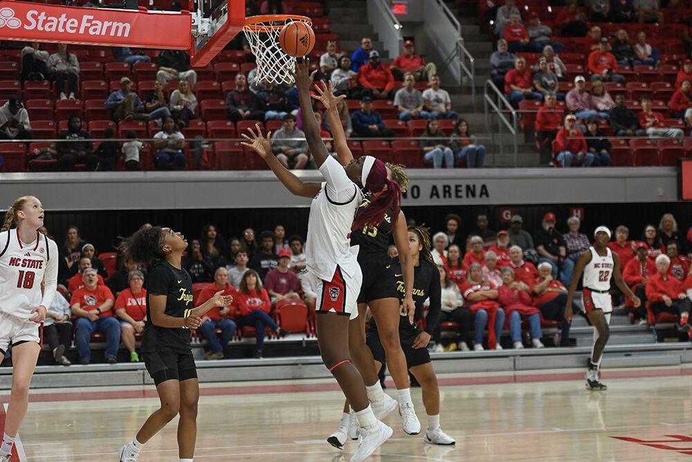 Freshman center Lorena Awou shoots the ball during the exhibition game against Anderson in Reynolds Coliseum on Tuesday, Oct. 29, 2024. The Wolfpack beat the Trojans 91-54.