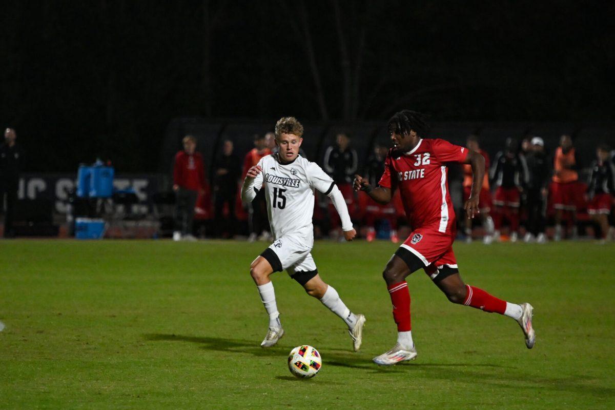 Sophomore forward Donavan Phillip drives down the field with the ball during the game agianst Louisville at Dail Soccer Field&#160;on Sunday, Oct. 27, 2024. NC State defeated Louisville 1-0.