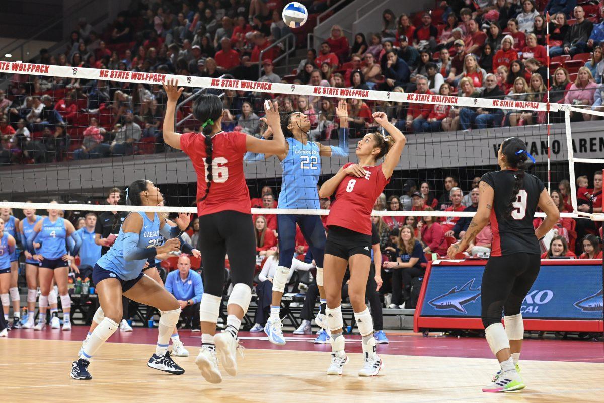 Senior middle blocker Jada Allen and graduate setter Naomi Cabello attempt to spike the ball during the match against UNC-Chapel Hill on Friday, Oct. 11, 2024. The Wolfpack defeated the Tar Heels 3-1.