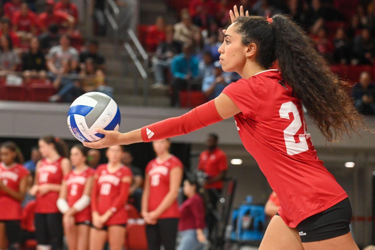 Junior libero Sydney Daniels prepares to serve during the volleyball match against UNC-Chapel Hill on Friday, Oct. 11, 2024. The Wolfpack defeated the Tar Heels 3-1.