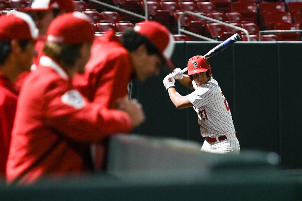 Sophomore infielder Chris McHugh warms up before batting during the game against Elon at Doak Field at Dail Park on Wednesday, Oct. 9, 2024. NC State beat Elon 20-4 to win the fall game at their home stadium.