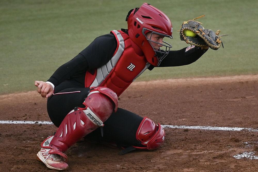 Junior catcher and infielder Ellington Whitaker secures the ball in her glove during the game against Elon at Dail Softball Stadium on Wednesday, Oct. 23, 2024. The Wolfpack won the game 14-7.