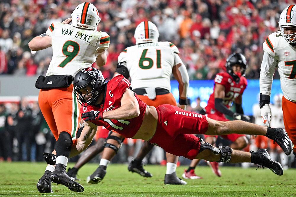 Graduate linebacker Payton Wilson tackles an opponent during the game against Miami at Carter-Finley Stadium on Saturday, Nov. 4, 2023. Wilson completed 16 total tackles. NC State beat Miami 20-6.