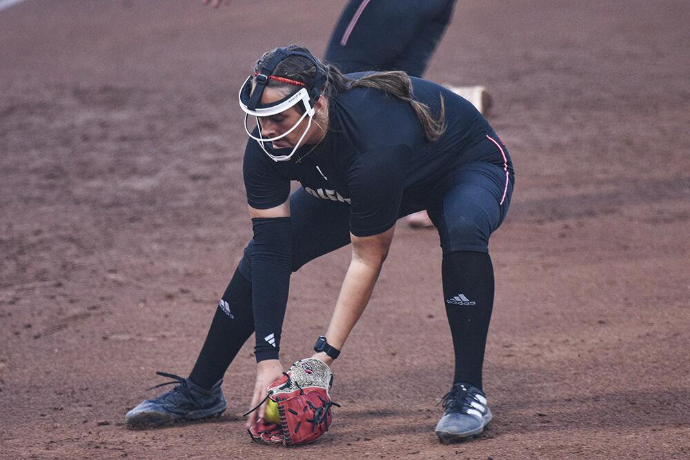 Sophomore Kayla Fekel fields the ground ball during the game against Elon at Dail Softball Stadium on Wednesday, Oct. 23, 2024. The Wolfpack won the game 14-7.