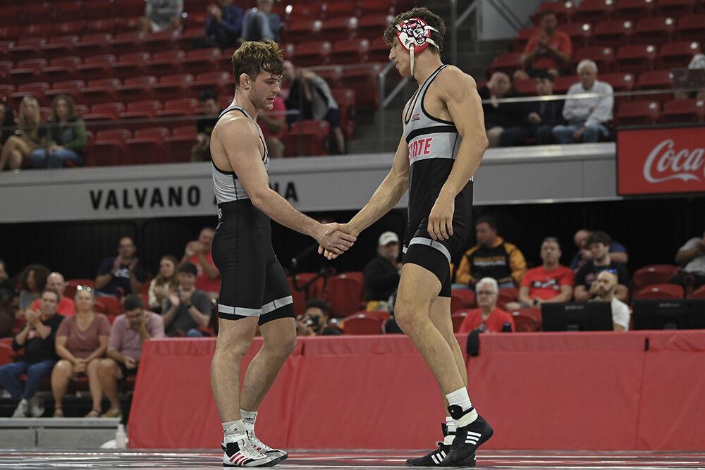 Redhshirt juniors Luke Ahrberg and Derek Fields shaking hands after their Wrestle-Offs duel at Reynolds Coliseum on Saturday, Oct. 26, 2024. Fields won 9-5.