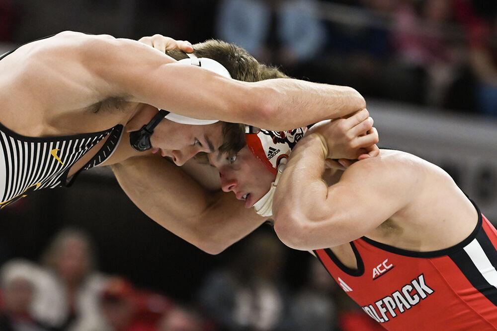 Redshirt freshman Koy Buesgens grapples with opponent during the duel against Appalachian State in Reynolds Coliseum on Friday, Nov. 15, 2024. Buesgens won the 149 bout 7-5. NC State beat App State 34-12.