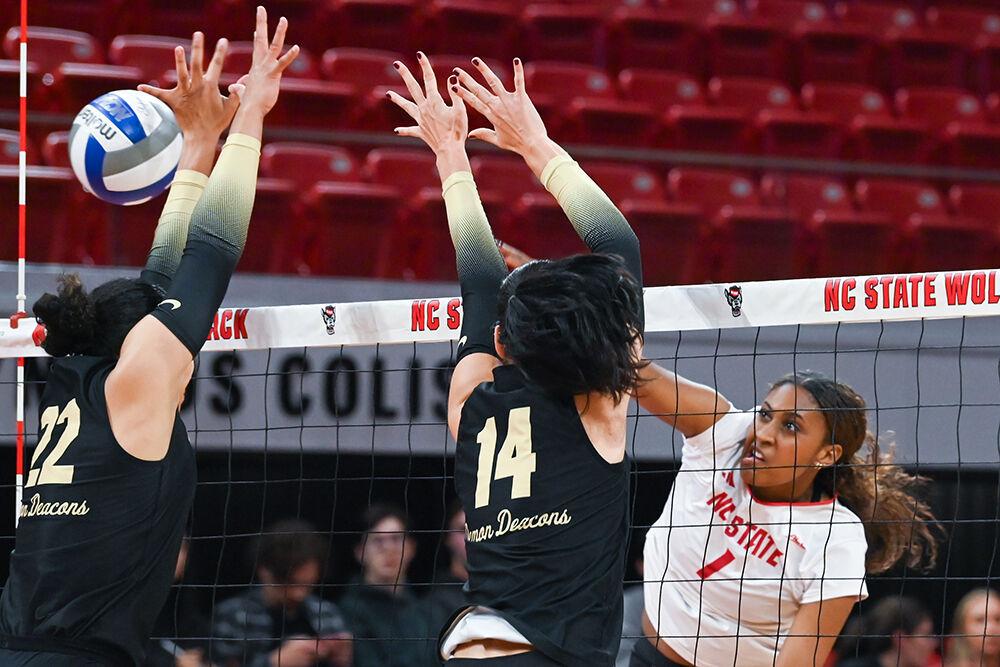 Senior outside hitter Madison Williams spikes the ball during the match against Wake Forest in Reynolds Coliseum on Wednesday, Nov. 13, 2024. Williams finished the game with five kills. NC State beat Wake Forest 3-0.