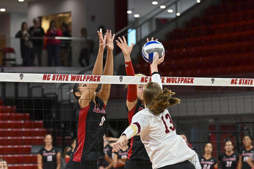 Graduate setter Naomi Cabello and middle blocker Sophie Groom block an attack during the match against Boston College in Reynolds Coliseum on Sunday, Nov. 3, 2024. Cabello and Groom combined for eight block assists during the match. NC State lost to Boston College 3-0.