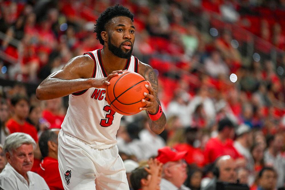 Senior guard Dontrez Styles prepares to pass the ball during the game against Presbyterian at the Lenovo Center on Friday, Nov. 8, 2024. Styles had seven rebounds and scored nine points. NC State beat Presbyterian 81-72.