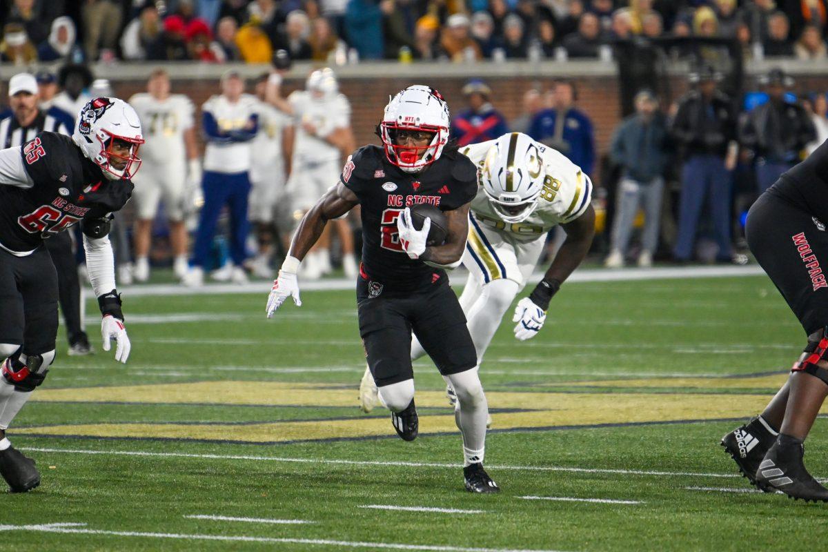 Redshirt freshman running back Hollywood Smothers rushes upfield during the game against Georgia Tech in Bobby Dodd Stadium at Hundai Field in Atlanta on Thursday, Nov. 21, 2024. Smothers rushed for 79 yards and one touchdown. NC State lost to Georgia Tech 30-29.