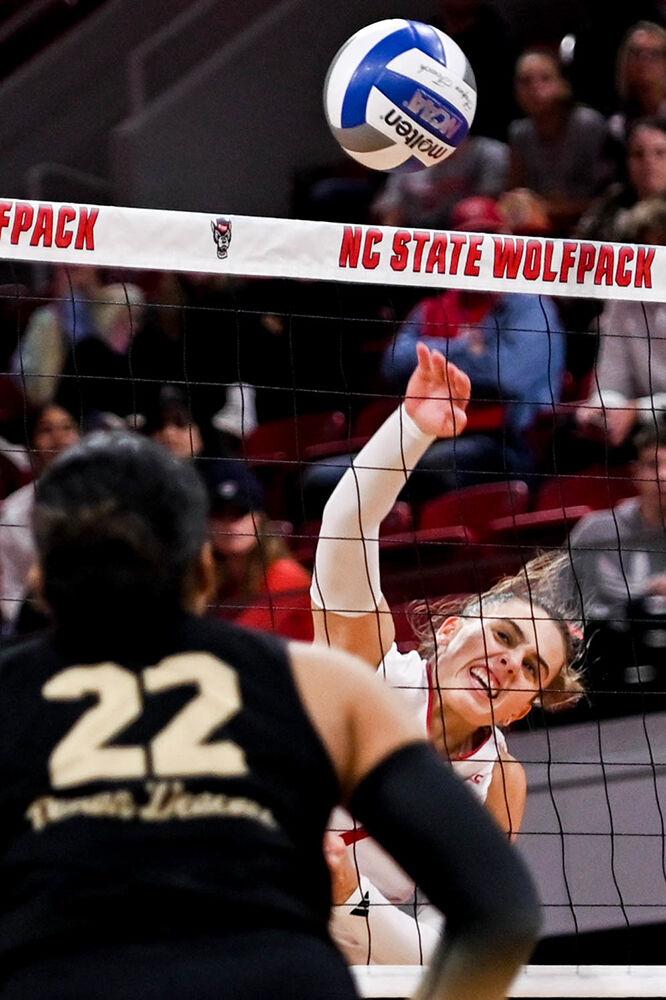 Junior outside hitter Ava Brizard spikes the ball during the match against Wake Forest in Reynolds Coliseum on Wednesday, Nov. 13, 2024. Brizard supported the Wolfpack with nine kills. NC State won all three sets against Wake Forest.