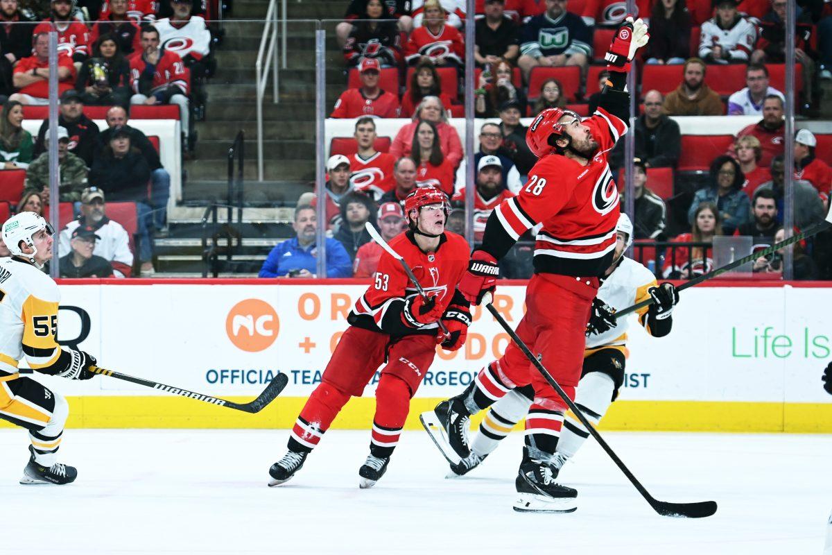 Right wing Jackson Blake watches as left wing William Carrier reaches to catch the puck during the game versus the Pittsburgh Penguins at Lenovo Center on Thursday, Nov. 7, 2024. The Hurricanes beat the Penguins 5-1.
