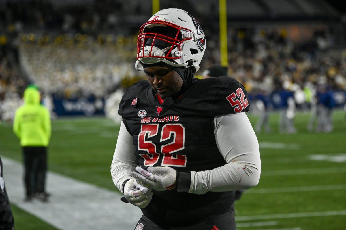 Graduate offensive tackle/guard Timothy McKay exits the field after the game against Georgia Tech in Bobby Dodd Stadium at Hundai Field in Atlanta on Thursday, Nov. 21, 2024. NC State lost to Georgia Tech 30-29.