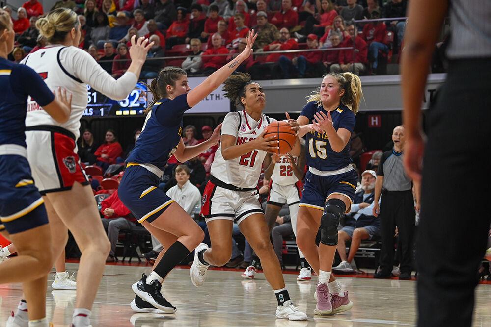 Graduate guard Madison Hayes drives toward the net during the game against Kent State in Reynolds Coliseum on Thursday, Nov. 14, 2024. Hayes made eight rebounds and scored nine points. NC State defeated Kent State 79-51.