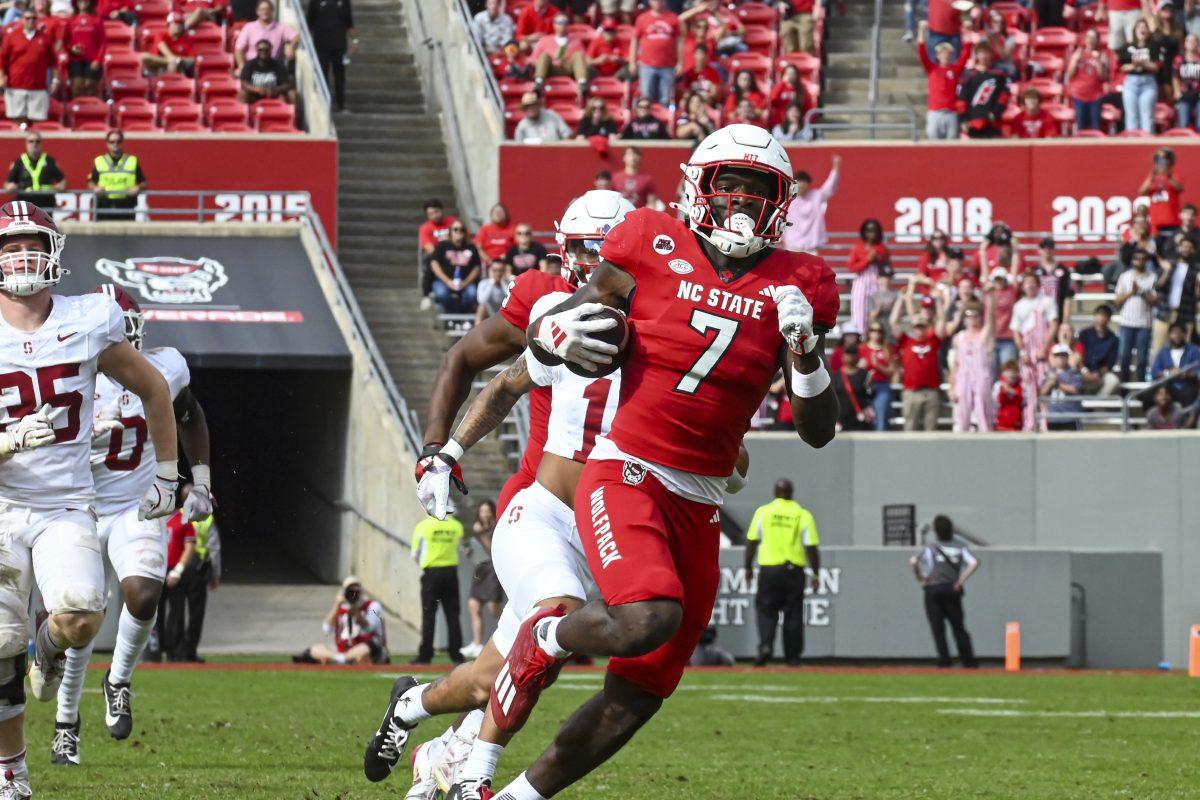 Graduate running back Jordan Waters runs the ball for a touchdown during the game against Stanford at Carter-Finley Stadium on Saturday, Nov. 2, 2024. Waters had five rushing attempts during the game. State beat Stanford 59-28.